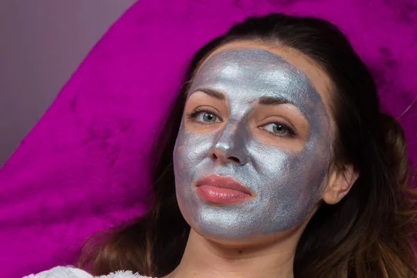 girl with rejuvenating mask on the face