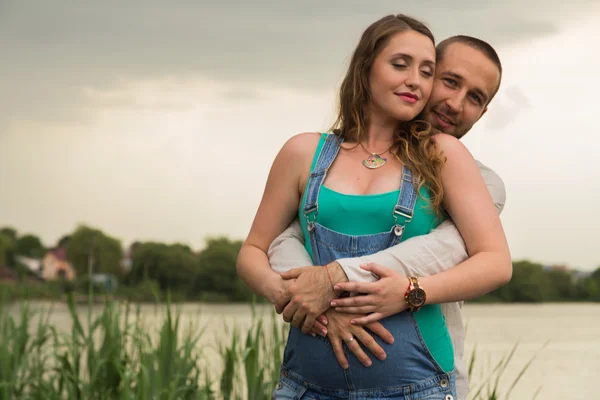 Beautiful family waiting for baby together — Stock Photo, Image