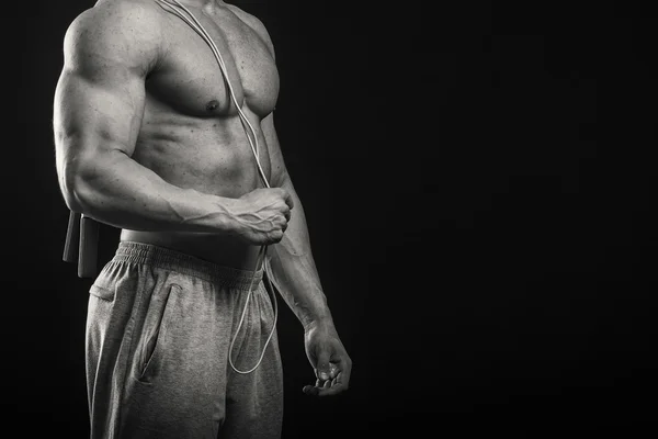 Hombre sosteniendo saltar la cuerda — Foto de Stock