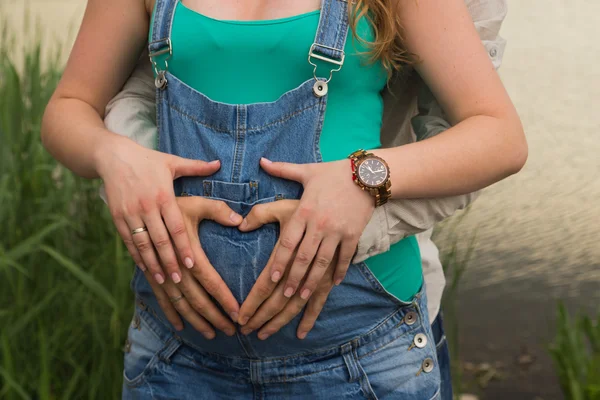 Beautiful family waiting for baby together