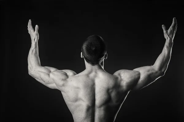 Man shows muscles — Stock Photo, Image