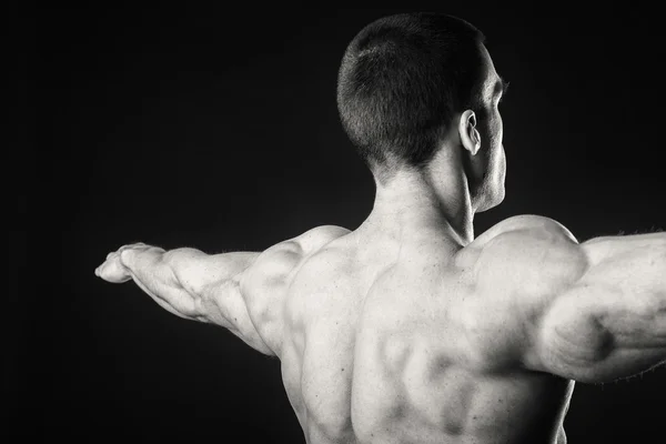 Back of man shows muscles — Stock Photo, Image