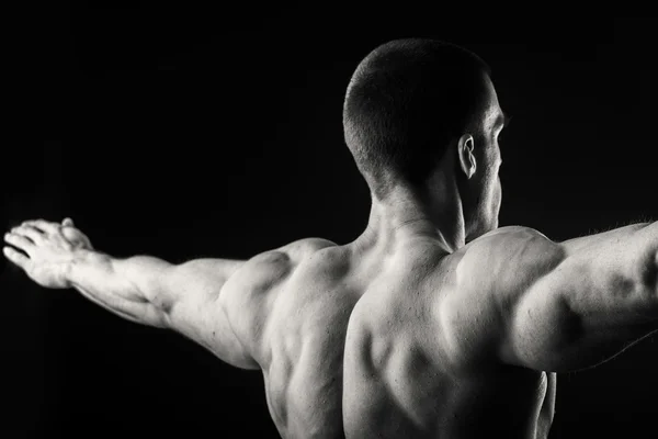 Back of man shows muscles — Stock Photo, Image