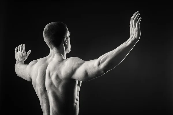 Back of man shows muscles — Stock Photo, Image