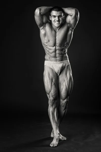 Man shows muscles — Stock Photo, Image