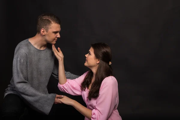 Young tender couple on a dark background — Stock Photo, Image