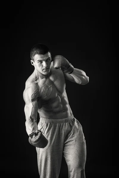 Athletic man in boxing gloves — Stock Photo, Image