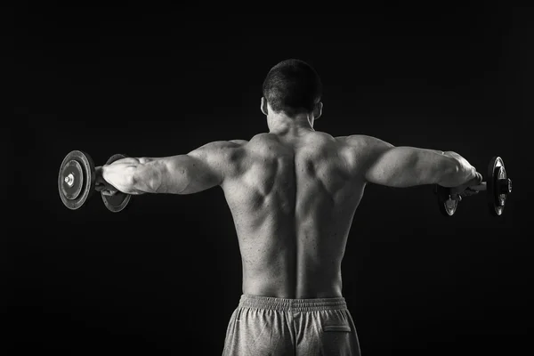 Hombre haciendo ejercicio con pesas —  Fotos de Stock