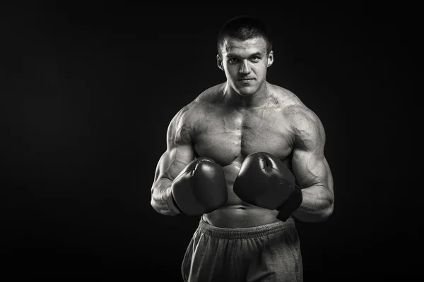 Athletic man in boxing gloves — Stock Photo, Image