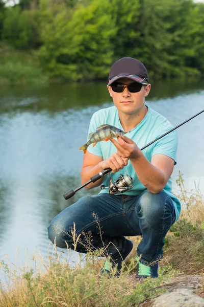 Man caught a fish — Stock Photo, Image