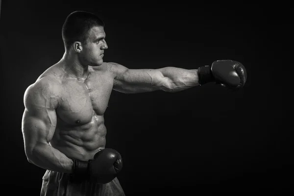 Professional boxer on a dark background — Stock Photo, Image