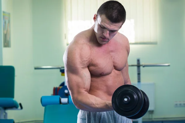 Man exercising with dumbbell — Stock Photo, Image