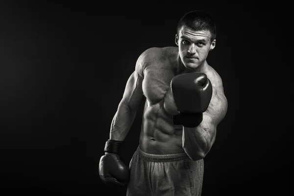 Athletic man in boxing gloves — Stock Photo, Image