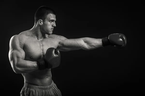 Athletic man in boxing gloves — Stock Photo, Image
