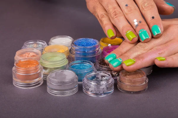 Hands and colorful pigments — Stock Photo, Image