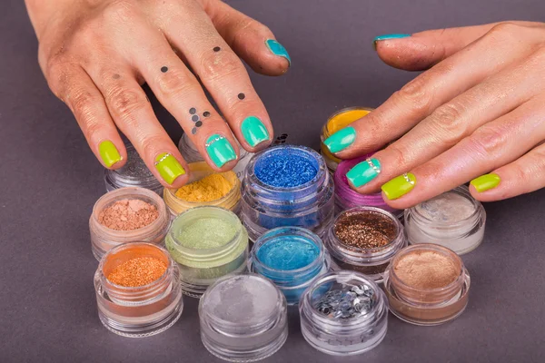 Hands and colorful pigments — Stock Photo, Image