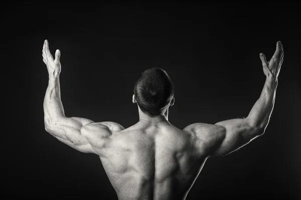 Man shows muscles — Stock Photo, Image