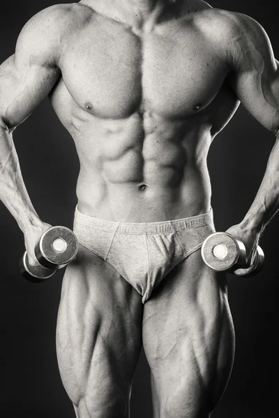 Hombre haciendo ejercicio con pesas — Foto de Stock