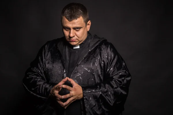 Actor plays role of priest — Stock Photo, Image