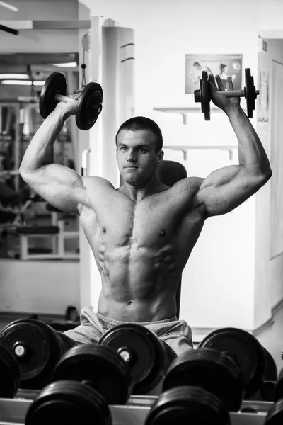 Man doing exercise with dumbbells — Stock Photo, Image