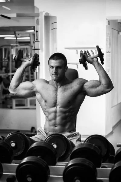 Man doing exercise with dumbbells — Stock Photo, Image