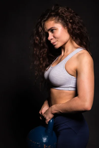 Athletic woman on a black background — Stock Photo, Image