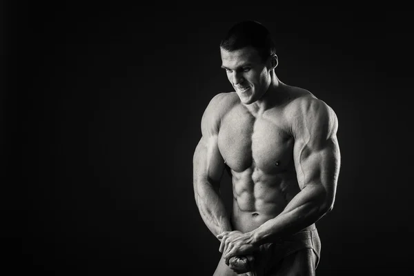 Man shows muscles — Stock Photo, Image