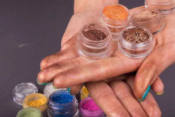 Colorful pigments on hands — Stock Photo, Image