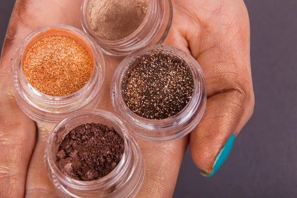 Jars with  glitter makeup
