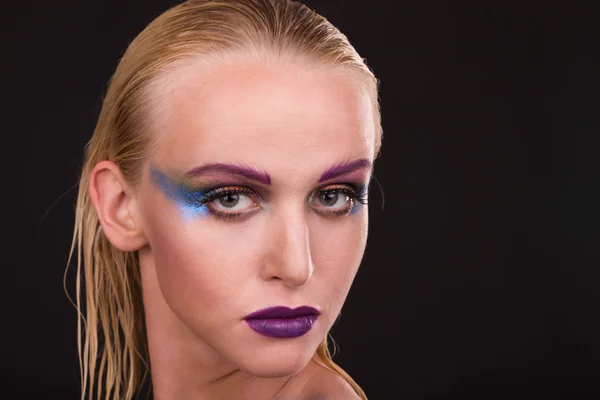 Beautiful model with art makeup on a dark background — Stock Photo, Image