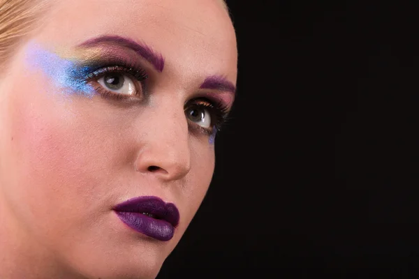 Beautiful model with art makeup on a dark background — Stock Photo, Image