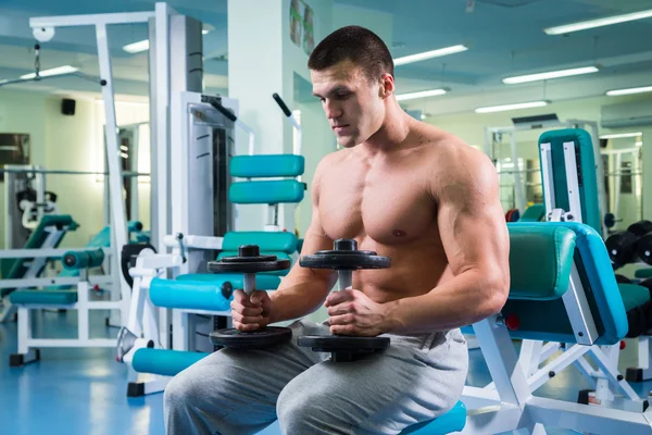 Strength training professional athlete in the gym — Stock Photo, Image