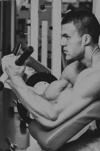 Strength training professional athlete in the gym — Stock Photo, Image