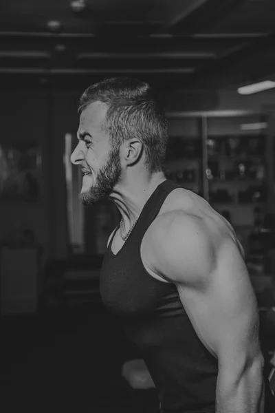 Strength training professional athlete in the gym — Stock Photo, Image