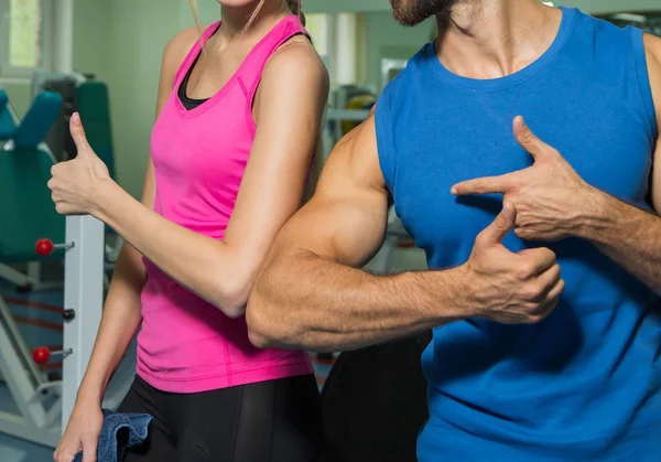 Young couple in the gym at the joint training — Stock Photo, Image