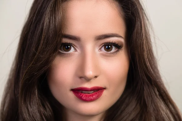 Beautiful brunette in a dark dress — Stock Photo, Image