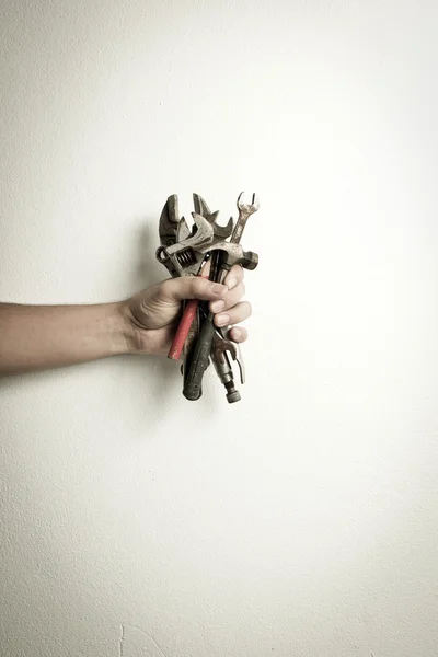 Hand of male holding old tools — Zdjęcie stockowe