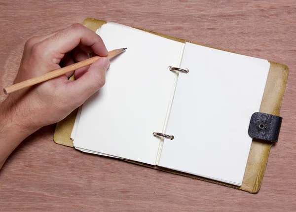 Hand writing blank notebook — Zdjęcie stockowe