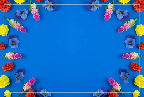 A series of photos on the theme of decorative flowers and backgrounds, flat design, patterns and top view, blue background, place for text, decorative service set, frames
