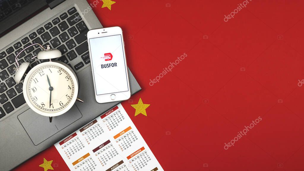 Kharkov, Ukraine - February 5, 2021: Booking.com logo application on a screen of Apple smartphone, creative flat lay banner, copy space photo
