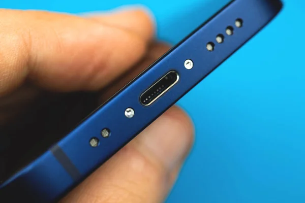 Kharkov, Ukraine - March 8, 2021: Apple iPhone 12 Mini lightning connector close up, repair Apple smartphone concept photo