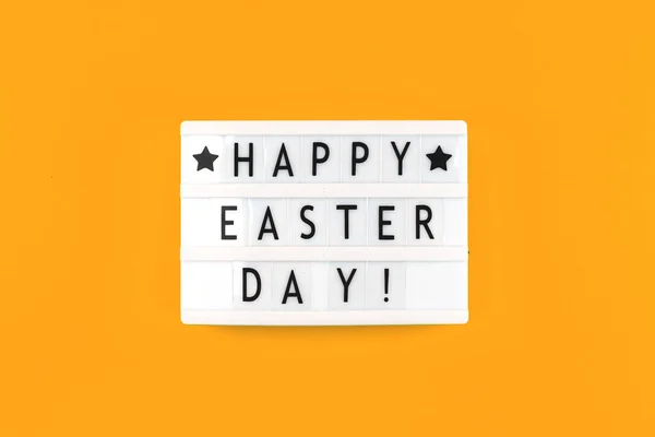 Happy Easter Day text message on a lightbox, greeting card concept photo