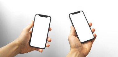 Kharkov, Ukrayna - 3 Nisan 2021: Apple iPhone ile Kolaj insan ellerinde 12 model beyaz ekran