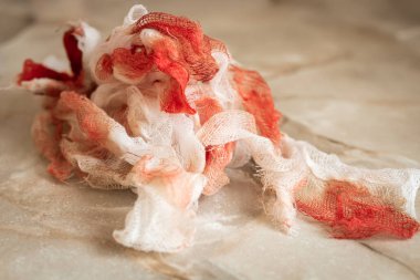Bloody bandages after a wound, first help concept photo