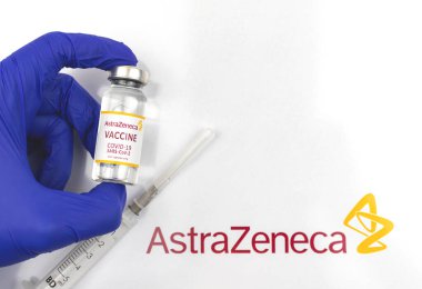 Kharkov, Ukraine - April 18, 2021: Doctor holds Astrazeneca COVID-19 vaccine vial, Europe vaccination concept background photo