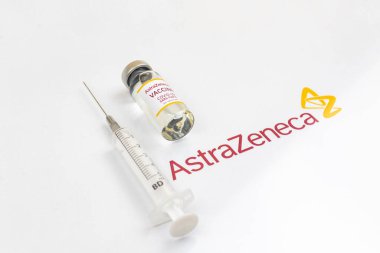Kharkov, Ukraine - April 18, 2021: AstraZeneca Oxford COVID-19 vaccine vial close-up with logo of the company