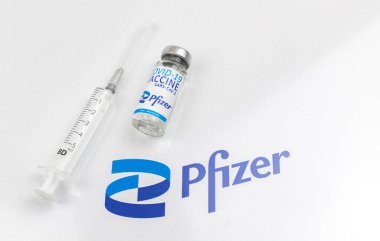 Kharkov, Ukraine - April 18, 2021: Pfizer COVID-19 vaccine developed by Biontech, vaccination background photo with company logo