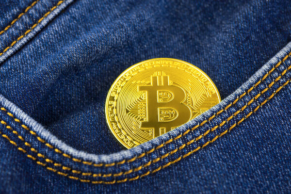 Golden bitcoin in pocket, crypto currency business and financial background, investment and savings concept