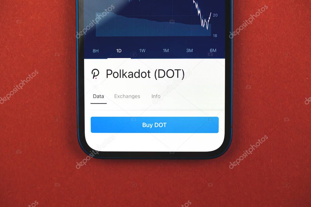 Buy Polkadot DOT cryptocurrency, mobile app with button, concept of online trade and exchange by using smartphone, banking application, top view photo of business office desk