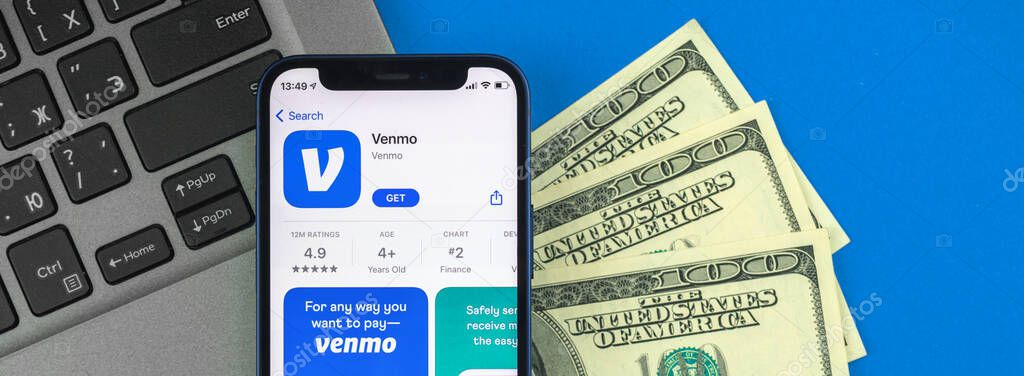 Kharkov, Ukraine - May 28, 2021: Venmo banking and finance app on the screen, background photo with money